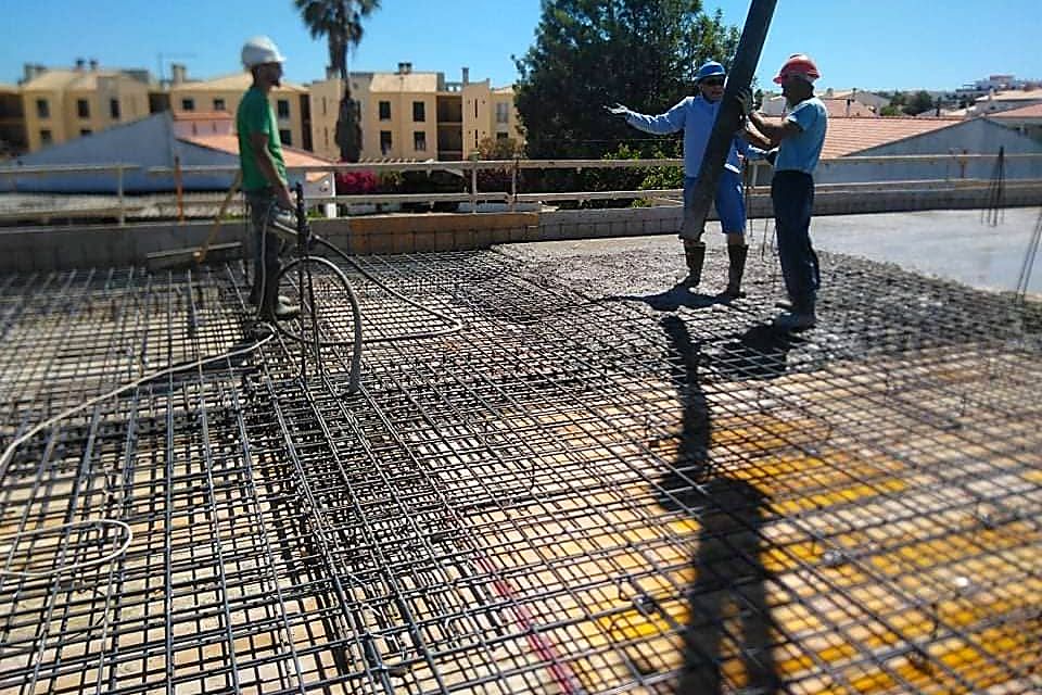 Slab reinforcement tied, with concrete placed by pump